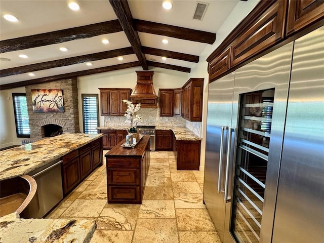 1415 Via Vallarta, Riverside, CA 92506 - kitchen featuring high end appliances, premium range hood, a center island, decorative backsplash, and recessed lighting