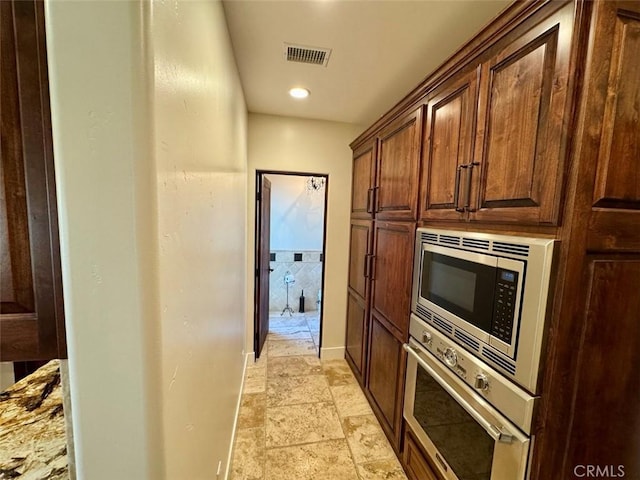 1415 Via Vallarta, Riverside, CA 92506 - hallway featuring light stone finish flooring, baseboards, and recessed lighting