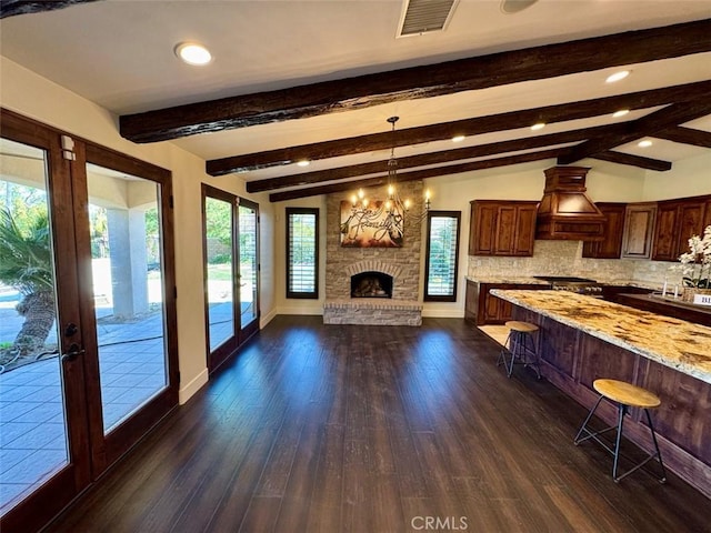 1415 Via Vallarta, Riverside, CA 92506 - unfurnished living room featuring french doors, dark wood-style floors, beamed ceiling, a chandelier, and recessed lighting