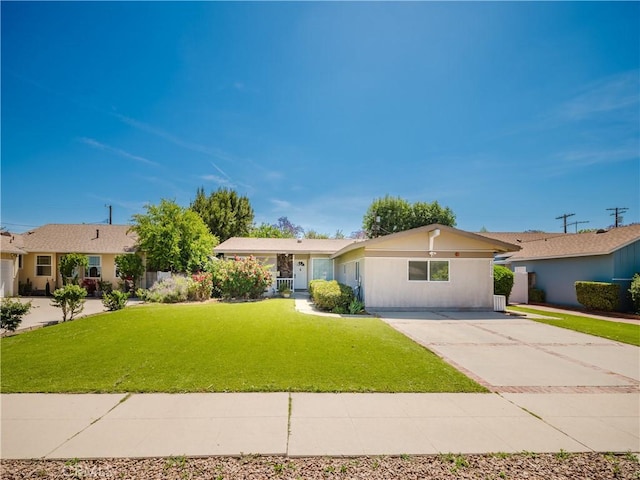 10022 Gothic Ave, North Hills, CA 91343 - ranch-style home with a front lawn and driveway