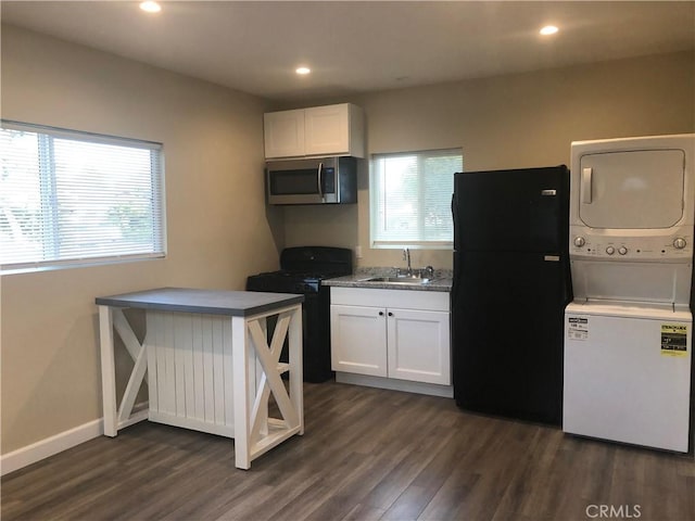 10022 Gothic Ave, North Hills, CA 91343 - kitchen featuring black appliances, stacked washer / dryer, a sink, plenty of natural light, and recessed lighting