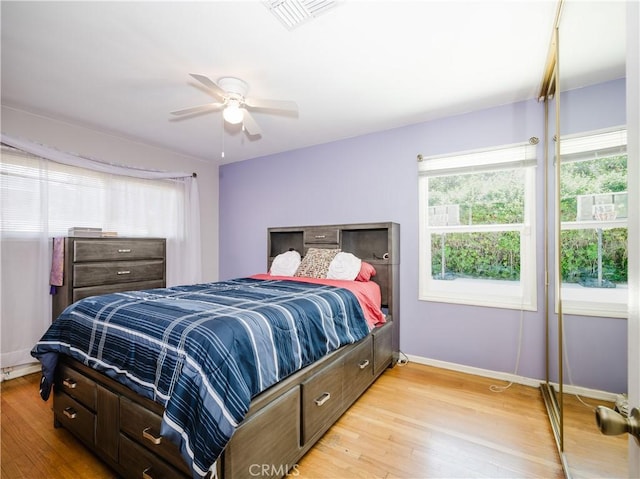 10022 Gothic Ave, North Hills, CA 91343 - bedroom with light wood finished floors, baseboards, and a ceiling fan