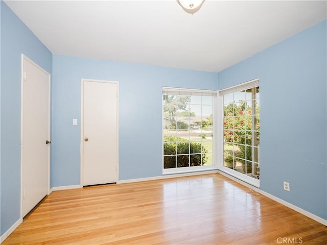 10022 Gothic Ave, North Hills, CA 91343 - unfurnished room with wood finished floors and baseboards