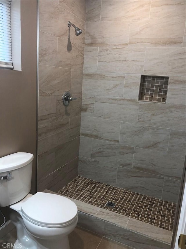 10022 Gothic Ave, North Hills, CA 91343 - bathroom with tiled shower and toilet