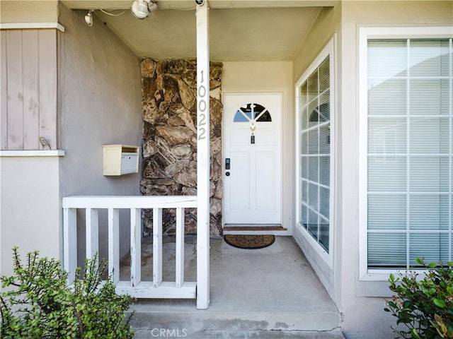 10022 Gothic Ave, North Hills, CA 91343 - entrance to property with a porch and stucco siding