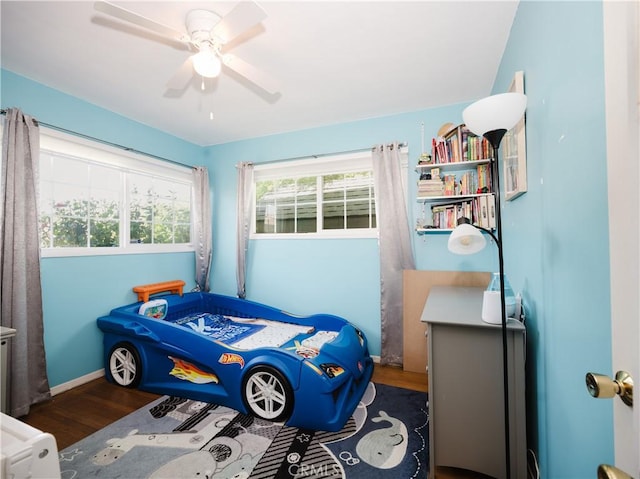10022 Gothic Ave, North Hills, CA 91343 - bedroom featuring wood finished floors, baseboards, and a ceiling fan