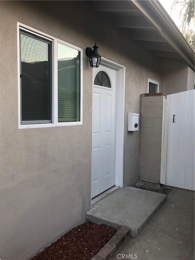 10022 Gothic Ave, North Hills, CA 91343 - view of exterior entry featuring stucco siding