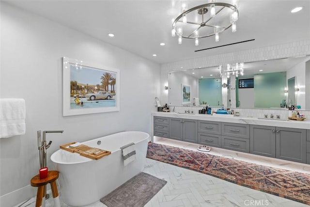 1010 Kings Rd, Newport Beach, CA 92663 - full bathroom featuring double vanity, a freestanding tub, a chandelier, and recessed lighting