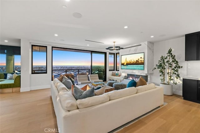 1010 Kings Rd, Newport Beach, CA 92663 - living room featuring light wood-type flooring, recessed lighting, a wall of windows, and baseboards