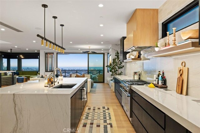 1010 Kings Rd, Newport Beach, CA 92663 - kitchen with modern cabinets, a sink, open floor plan, stainless steel range, and recessed lighting