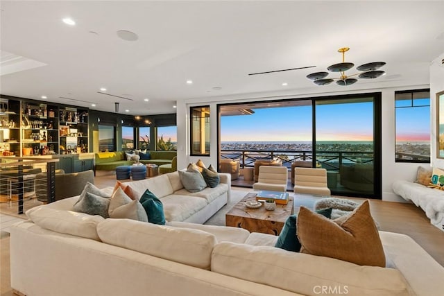 1010 Kings Rd, Newport Beach, CA 92663 - living area featuring a wall of windows, recessed lighting, and wood finished floors