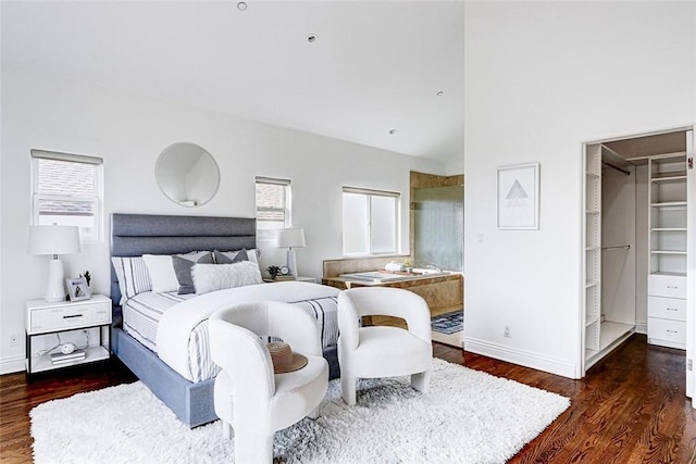 602 N Juanita Ave Unit A, Redondo Beach, CA 90277 - bedroom with wood finished floors, baseboards, vaulted ceiling, and a walk in closet
