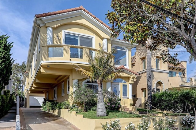 602 N Juanita Ave Unit A, Redondo Beach, CA 90277 - mediterranean / spanish-style home featuring stucco siding, a tile roof, a balcony, and concrete driveway