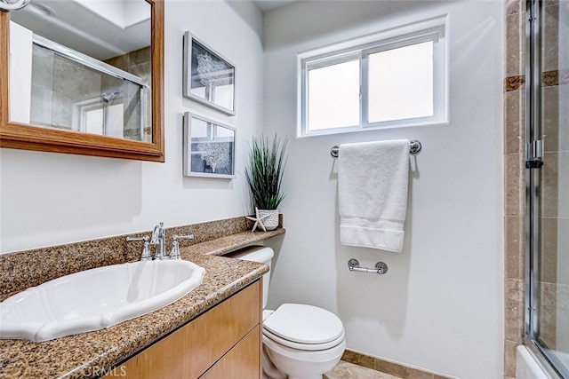 602 N Juanita Ave Unit A, Redondo Beach, CA 90277 - bathroom featuring toilet, a tile shower, vanity, and tile patterned flooring