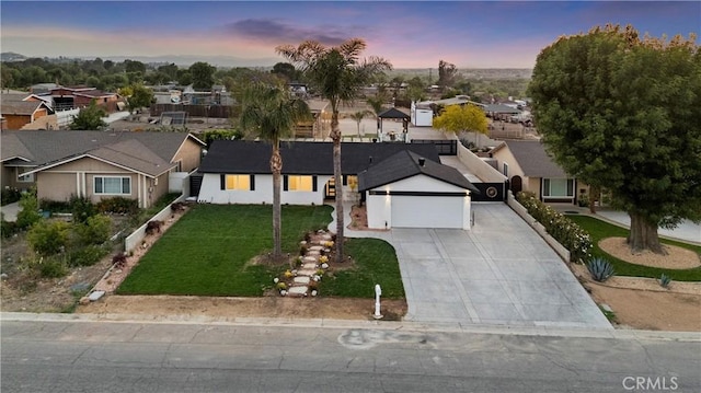 5080 Pinto Pl, Norco, CA 92860 - ranch-style house featuring a garage, a residential view, concrete driveway, and a front lawn