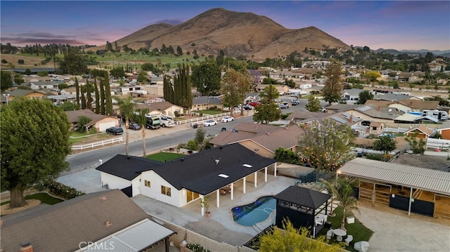 5080 Pinto Pl, Norco, CA 92860 - aerial perspective of suburban area featuring a mountainous background and a pool area