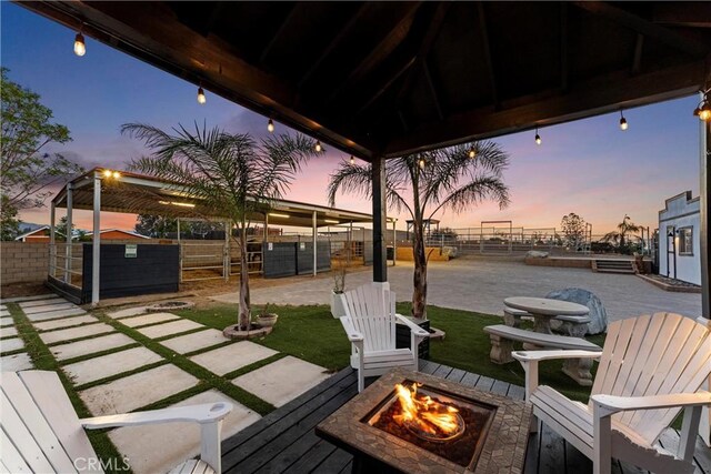 5080 Pinto Pl, Norco, CA 92860 - wooden terrace with a fire pit and an outdoor structure