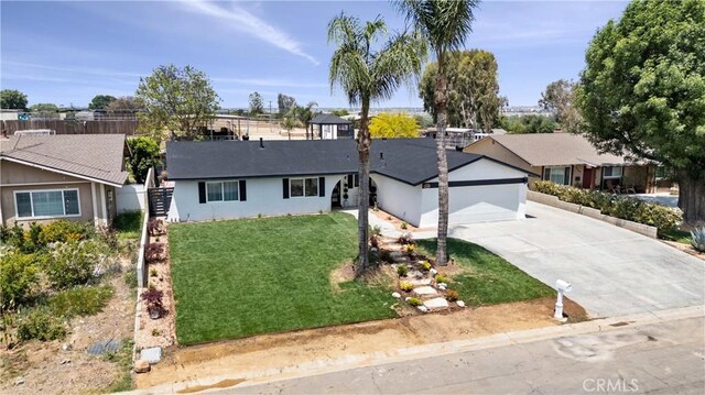 5080 Pinto Pl, Norco, CA 92860 - single story home with concrete driveway, a garage, and stucco siding