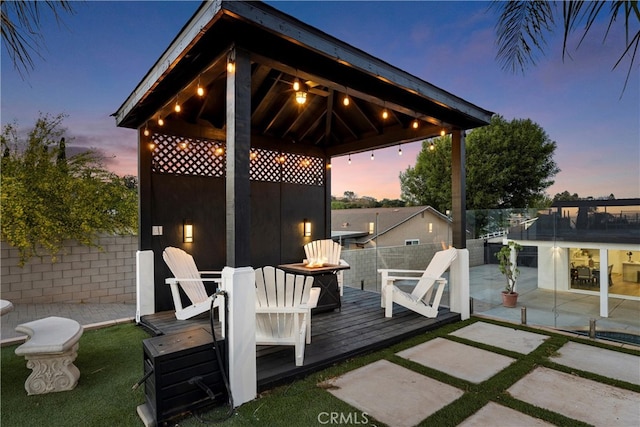 5080 Pinto Pl, Norco, CA 92860 - deck at dusk with an outdoor fire pit and a gazebo