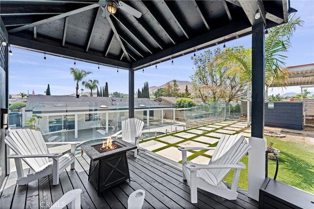 5080 Pinto Pl, Norco, CA 92860 - wooden deck featuring an outdoor fire pit, a ceiling fan, and a mountain view