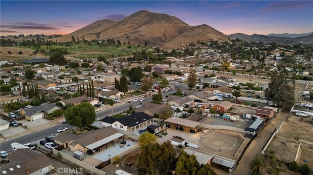 5080 Pinto Pl, Norco, CA 92860 - aerial overview of property's location with a mountain backdrop and nearby suburban area