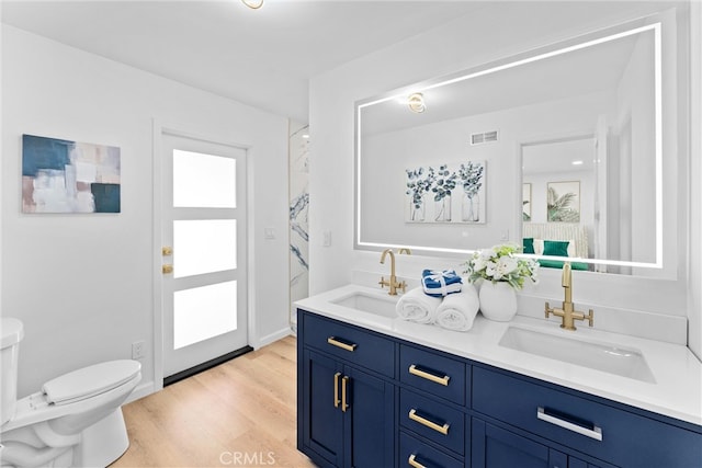 5080 Pinto Pl, Norco, CA 92860 - full bathroom with toilet, double vanity, and wood finished floors