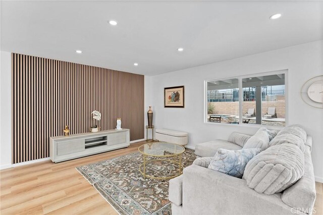 5080 Pinto Pl, Norco, CA 92860 - living area featuring recessed lighting, wood finished floors, an accent wall, and baseboards