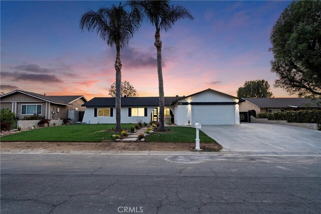 5080 Pinto Pl, Norco, CA 92860 - ranch-style house with an attached garage, concrete driveway, a yard, and stucco siding