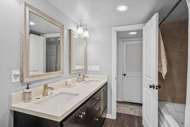 3404 Oak Cliff Dr Unit 8, Fallbrook, CA 92028 - full bath featuring double vanity, wood finished floors, shower / tub combination, and baseboards