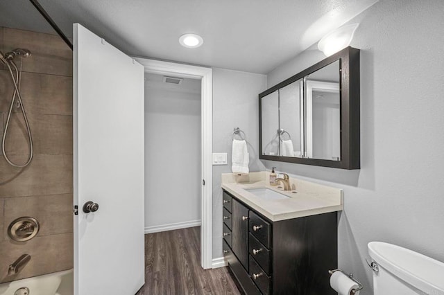 3404 Oak Cliff Dr Unit 8, Fallbrook, CA 92028 - full bath featuring vanity, wood finished floors, shower / bath combination, toilet, and baseboards