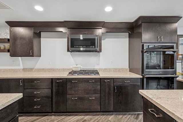 3404 Oak Cliff Dr Unit 8, Fallbrook, CA 92028 - kitchen featuring stainless steel appliances, light countertops, wood finished floors, and recessed lighting