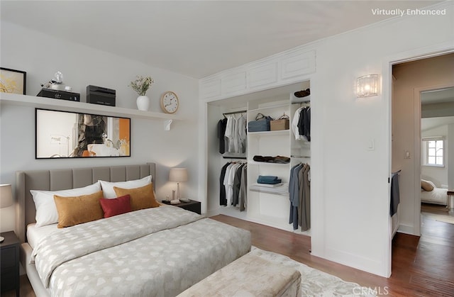 9341 Grand Dr, Huntington Beach, CA 92646 - bedroom featuring a closet and wood finished floors