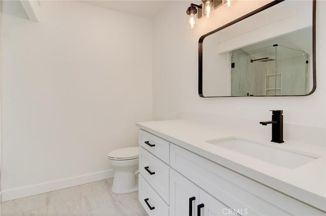 9341 Grand Dr, Huntington Beach, CA 92646 - full bath featuring baseboards, marble look tile flooring, vanity, toilet, and an enclosed shower