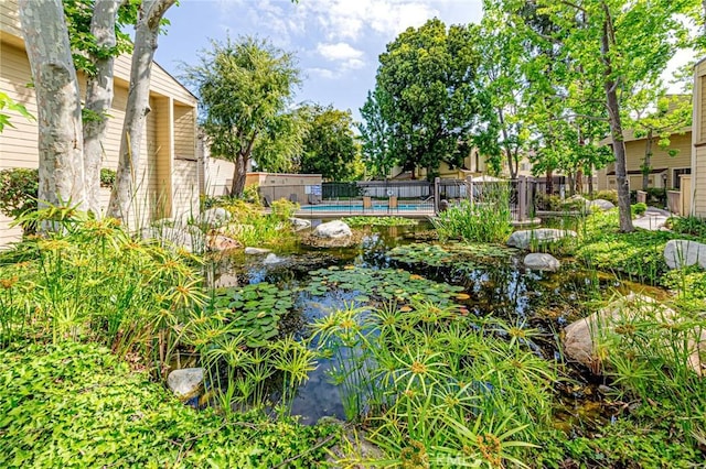 5401 Twin Lakes Dr, Cypress, CA 90630 - view of yard featuring a garden pond