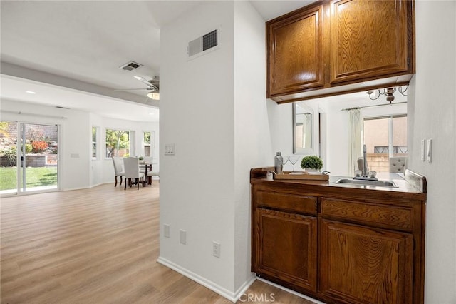 915 W Solano St, Upland, CA 91784 - bar area with light wood-style floors and ceiling fan