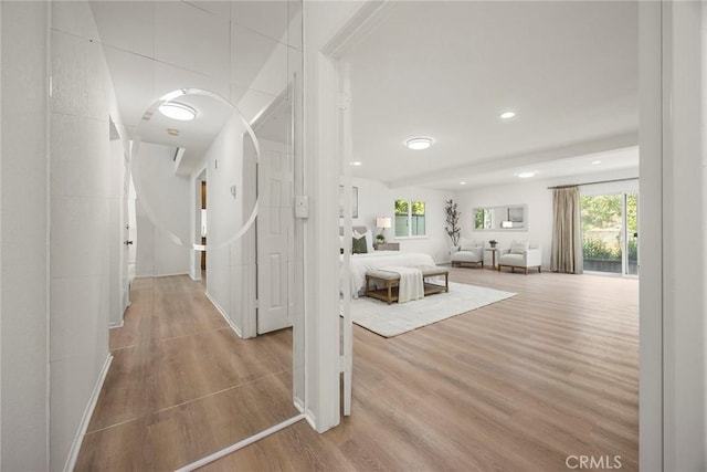915 W Solano St, Upland, CA 91784 - hallway featuring wood finished floors, plenty of natural light, and recessed lighting