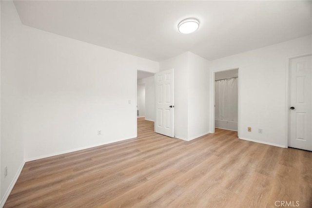 915 W Solano St, Upland, CA 91784 - unfurnished bedroom with light wood-style floors and baseboards