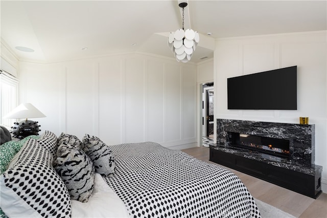 1110 Kings Rd, Newport Beach, CA 92663 - bedroom featuring a decorative wall, wood finished floors, and a fireplace