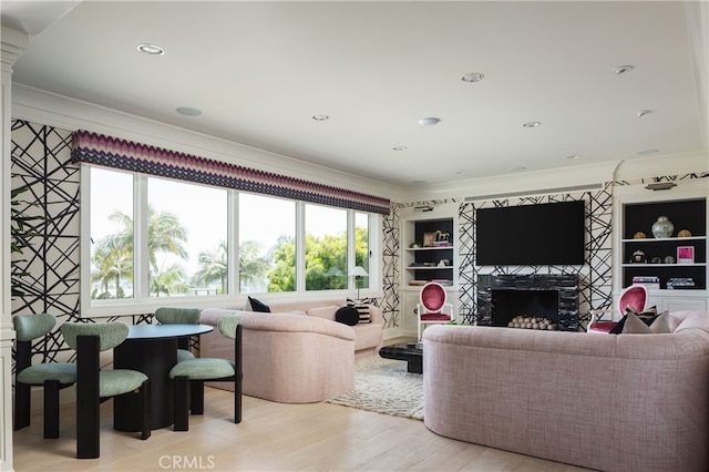 1110 Kings Rd, Newport Beach, CA 92663 - living room featuring ornamental molding, a fireplace, and light wood-style flooring
