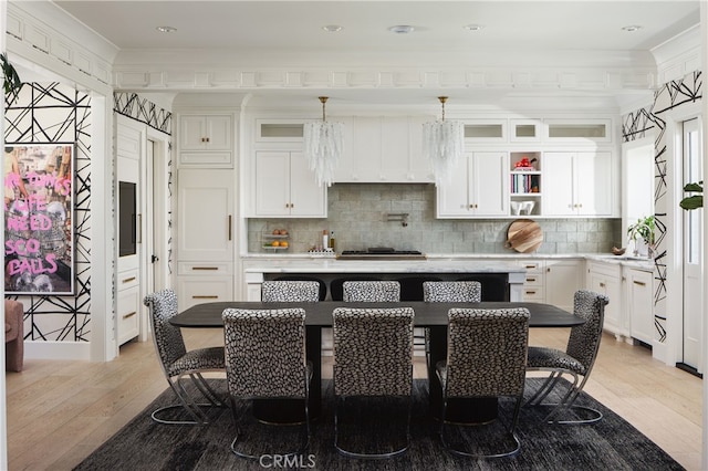 1110 Kings Rd, Newport Beach, CA 92663 - kitchen with a center island, light wood-style flooring, white cabinets, and recessed lighting