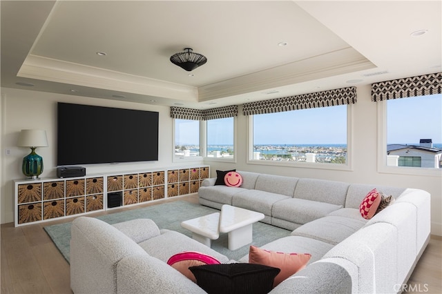 1110 Kings Rd, Newport Beach, CA 92663 - living area with a raised ceiling, wood finished floors, crown molding, and recessed lighting