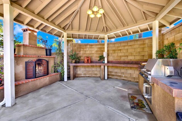 907 Rockwell Springs Ct, Escondido, CA 92025 - view of patio / terrace with a gazebo and an outdoor brick fireplace