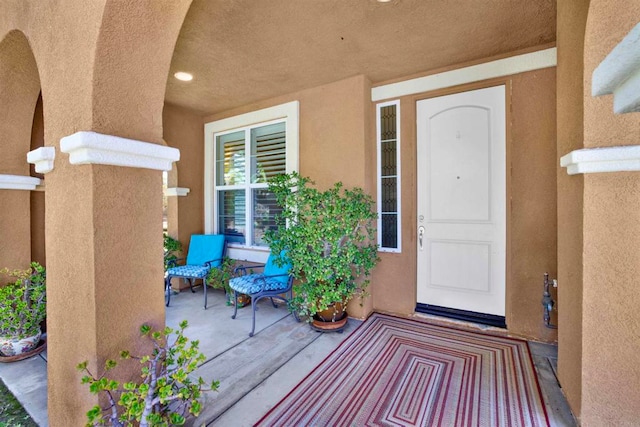 907 Rockwell Springs Ct, Escondido, CA 92025 - view of exterior entry with stucco siding and covered porch