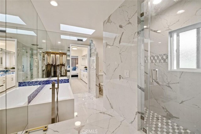 218 Evening Star Ln, Newport Beach, CA 92660 - full bath with a skylight, vanity, marble tiled flooring, a marble finish shower, and ensuite bathroom