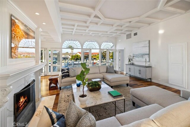 218 Evening Star Ln, Newport Beach, CA 92660 - living room featuring coffered ceiling, wood finished floors, french doors, a fireplace, and baseboards