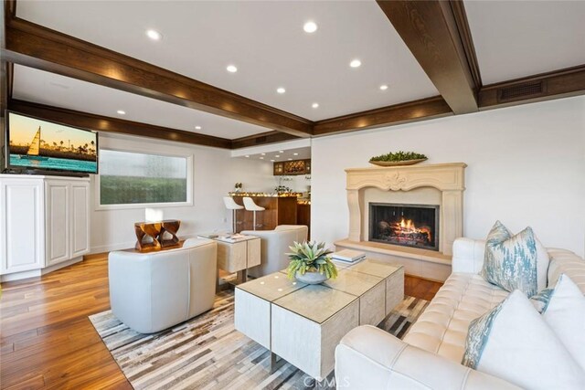 218 Evening Star Ln, Newport Beach, CA 92660 - living room with beam ceiling, light wood finished floors, a fireplace, recessed lighting, and crown molding