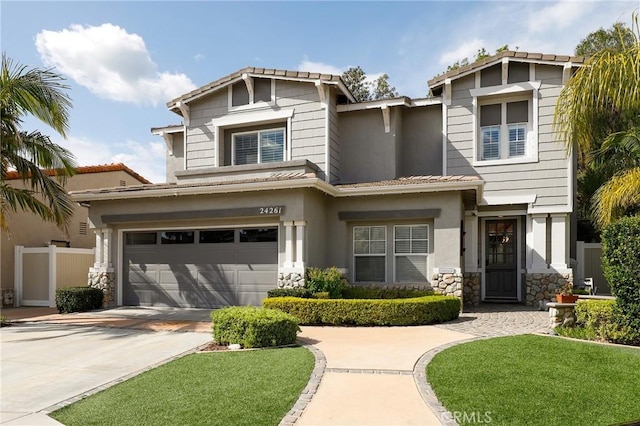 24261 Ernest Johnson Cir, Yorba Linda, CA 92887 - craftsman-style house with an attached garage, stone siding, concrete driveway, stucco siding, and a tiled roof