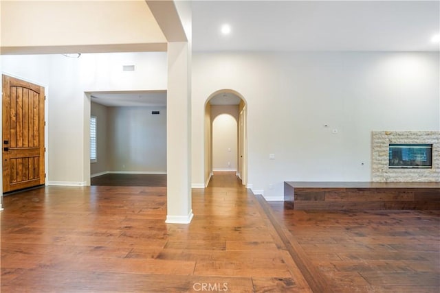 12160 Glines Ct, Tustin, CA 92782 - entrance foyer with wood finished floors, arched walkways, a fireplace, and recessed lighting