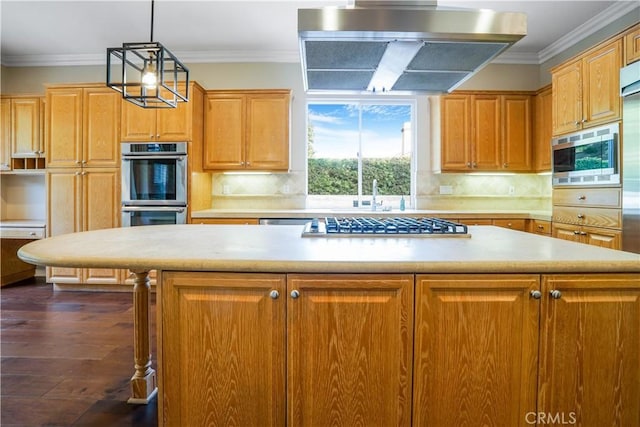 12160 Glines Ct, Tustin, CA 92782 - kitchen with stainless steel appliances, wall chimney exhaust hood, light countertops, dark wood finished floors, and crown molding