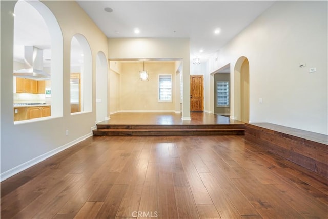 12160 Glines Ct, Tustin, CA 92782 - spare room featuring hardwood / wood-style floors and arched walkways